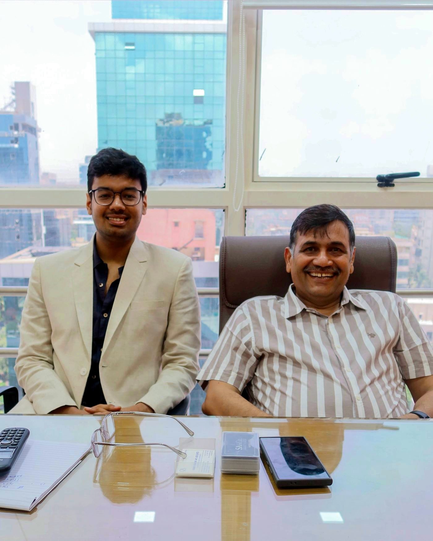 CA Sahil Agarwal and CA Niranjan Agarwal at their desk in the Andheri West office